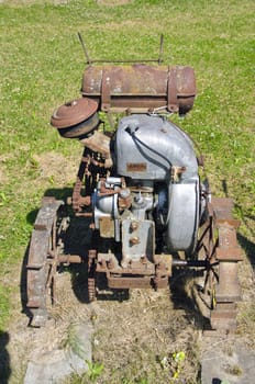 old agriculture motor in farm on grass