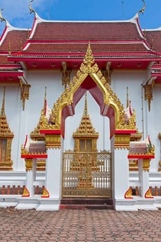 Beautiful Buddhist temple on  background of blue sky, Thailand.