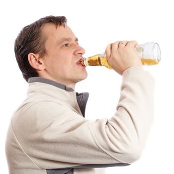 Man drinking beer from a glass bottle on a white background