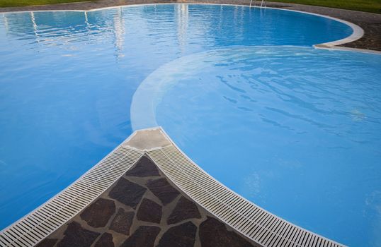 Morning by nice Italian swimming pool at summertime.