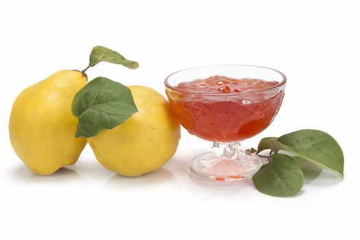 Still life with quinces and quince jelly in a glass cup