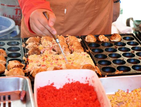 Japanese takoyaki balls at a food market 