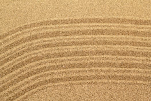 Sandy beach background with lines. Detailed sand texture. Top view 