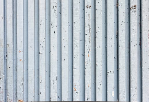 the blue old painted wooden fence, naturally weathered