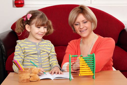 mother and daughter doing homework