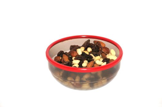 Nuts and raisin in a plate on a white background