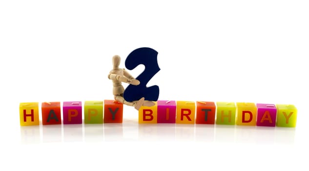 happy birthday candle letters with puppet and the number two
