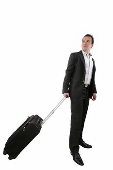 Young business man walking on white background with his trolley bag