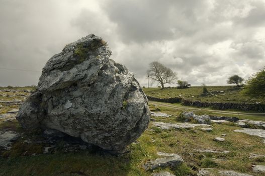 an Ireland landscape with rock