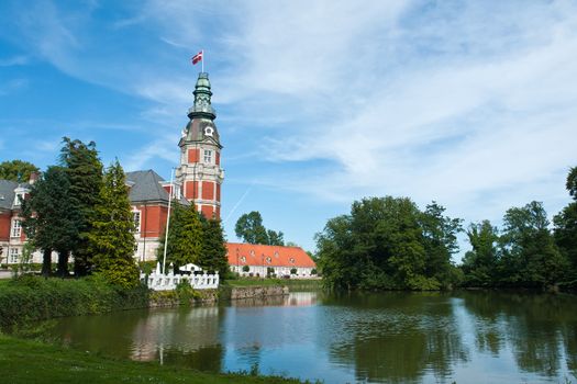 Hvedholm castle slot landmark  in Funen Denmark view view from the lake garden