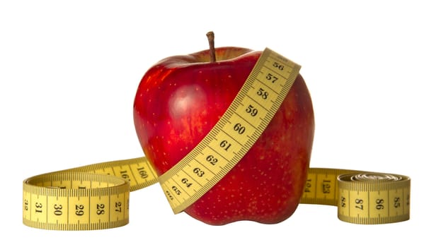 red apple and measuring tape on a white background
