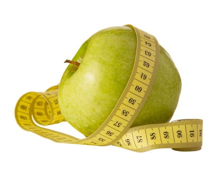 green apple and measuring tape on a white background