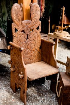 Wooden big brown carved armchair
