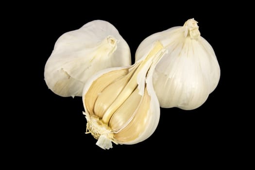 Garlic bulbs isolated on black background