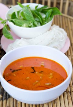  pork in ground peanut-coconut cream curry and  rice vermicelli served with fresh vegetable