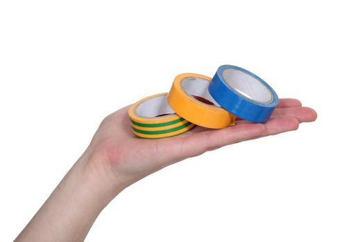 hand showing rolls of adhesive tape