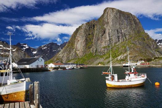 Traditional fishing boats in scenic harbor on Lofoten islands in Norway