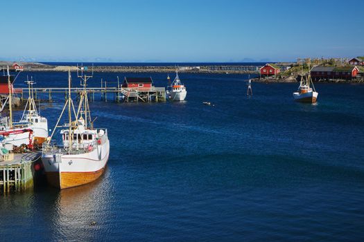 Traditional norwegian fishing boats in town of Reine on Lofoten islands