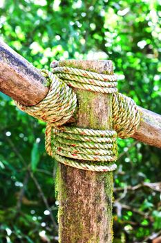 The three pieces of wood tied with rope ship.