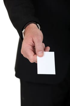 Hand of a man giving business card
