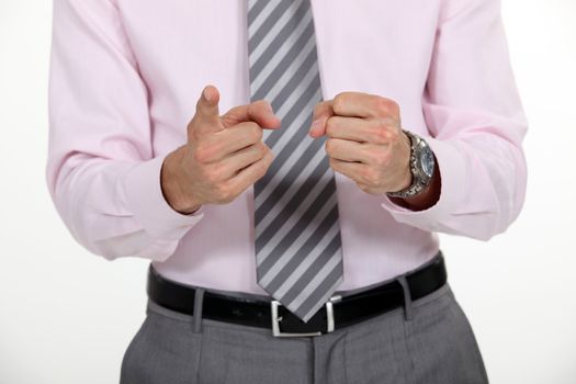 A cropped picture of a businessman counting on his fingers.