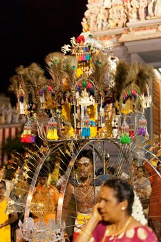 SINGAPORE – 2013 JANUARY 27: Devotee carrying a kavadi at Thaipusam taken on January 27, 2013 in Singapore. Hindu festival to worship and to make offerings to god Muruga. EDITORIAL USE ONLY!! 