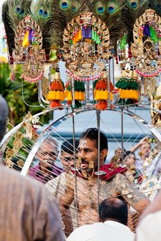 SINGAPORE – 2013 JANUARY 27: Devotee carrying a kavadi at Thaipusam taken on January 27, 2013 in Singapore. Hindu festival to worship and to make offerings to god Muruga. EDITORIAL USE ONLY!! 