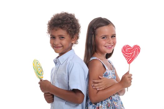 children eating lollipops