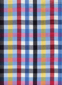 Blue, red, black and yellow square fabric pattern background 