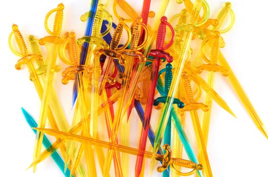Colorful  plastic sticks for sandwiches in a white background