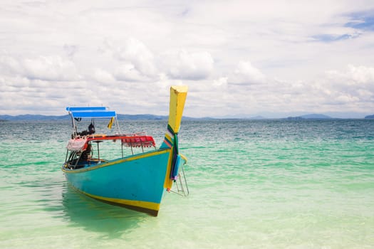Long Tail Boat at tropical White Sand Beach Trang near Phuket Thailand
