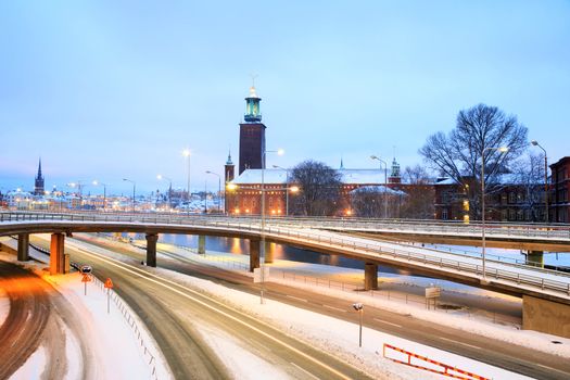 Stockholm Cityhall at dusk with transportation light trail Sweden