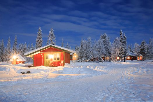 Winter landscape with cabin hut at night in Kiruna Lapland Sweden at Night with star trail