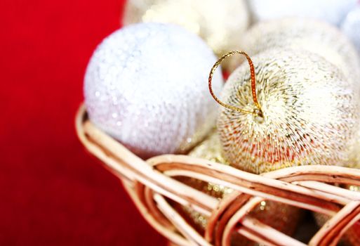 Golden Christmas  balls and toy drum on red background