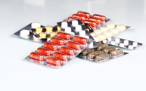 Packs of pills and tablets. Medical background