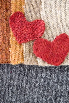 two hearts on colorful fabric background