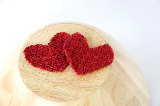 two red heart on wooden background