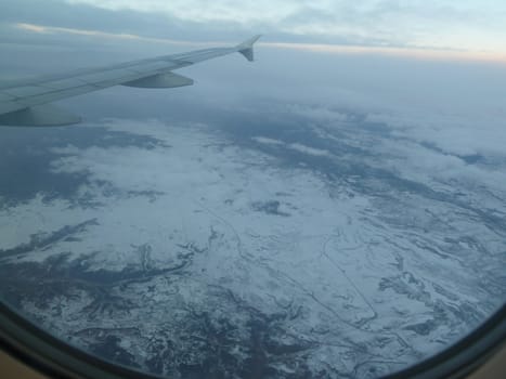 mountain snow from a plane as a background