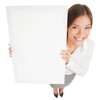 Woman showing a white board sign poster. High angle shot of attractive smiling woman with a blank white board isolated on white background. Mixed race Asian Caucasian business woman smiling happy.