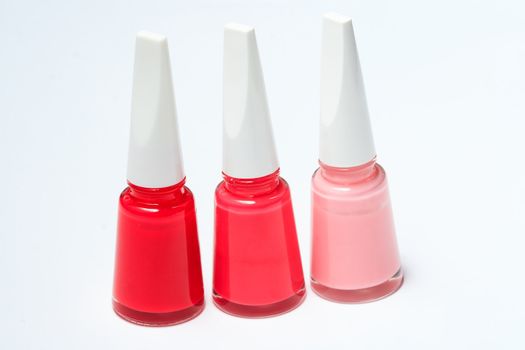 Set of color nail polish on white