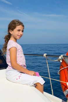 child happy girl sailing happy boat at blue sea ocean