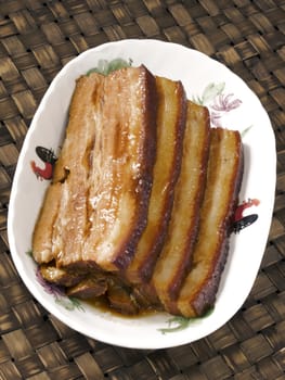 close up of a plate of braised pork belly