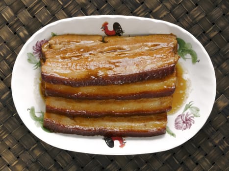 close up of a plate of braised pork belly