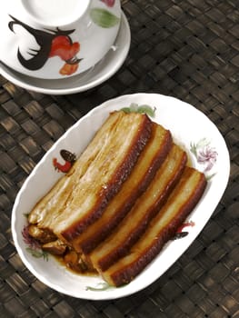 close up of a plate of braised pork belly