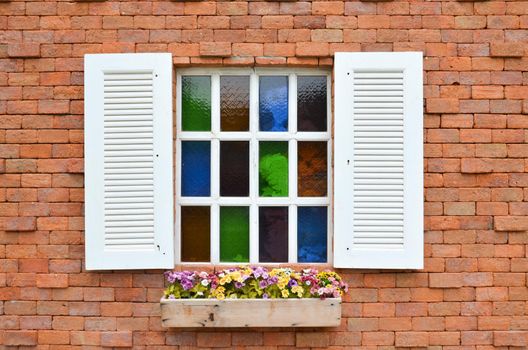 The white planter under the window.