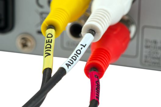 tulip wires video audio pluged into dvb-t tv receiver back side connection sockets on white background