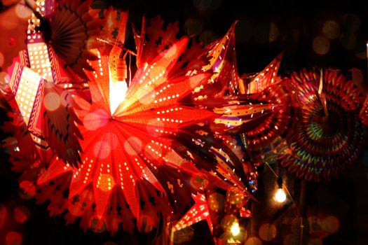 Traditional lanterns lit in festive decoration lights during the Diwali festival in India.