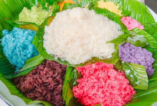 Thai dessert colorful sticky rice with egg custard on banana leaf
