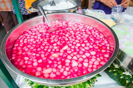 Thai dessert red sweet ruby framework in big stainless steel bowl