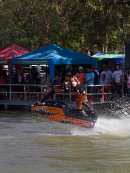 SARABURI THAILAND-JANUARY 20: Boonlue Korbangyang in action during show Freestyle the Jet ski  stunt action  on Jan 20, 2013 in SARABURI,Thailand.